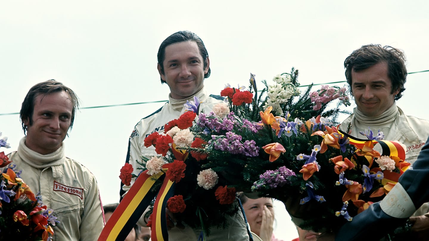 Pedro Rodriguez after his victory in the 1970 Belgian Grand Prix, sharing the podium with second and third placed Chris Amon and Jean-Pierre Beltoise (Photo by Bernard Cahier/Getty Images)