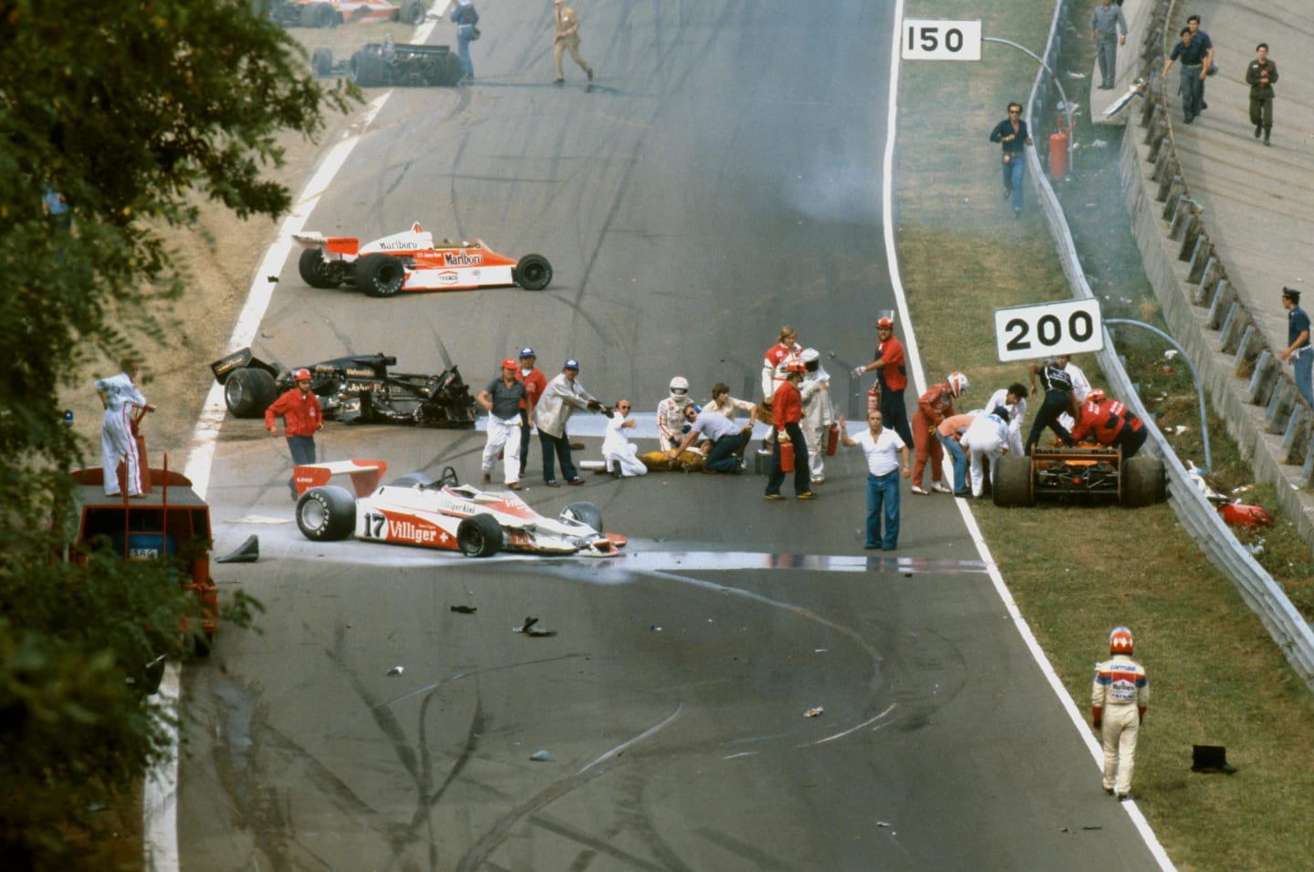The aftermath of the first lap accident. Ronnie Peterson who later died from his injuries is lying