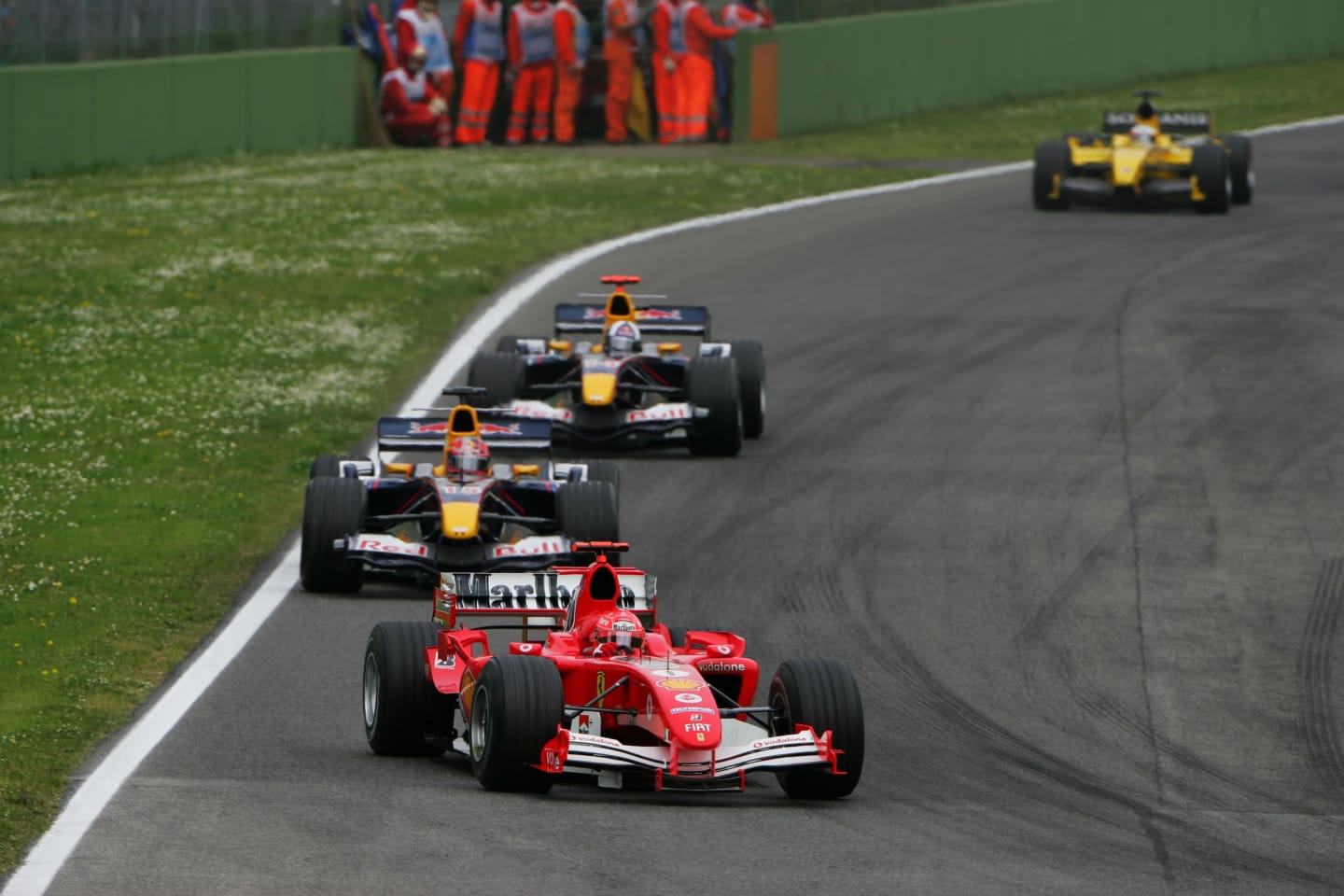 Michael Schumacher (GER) Ferrari F2005 leads Vitantonio Liuzzi (ITA) Red Bull Racing 
Formula One