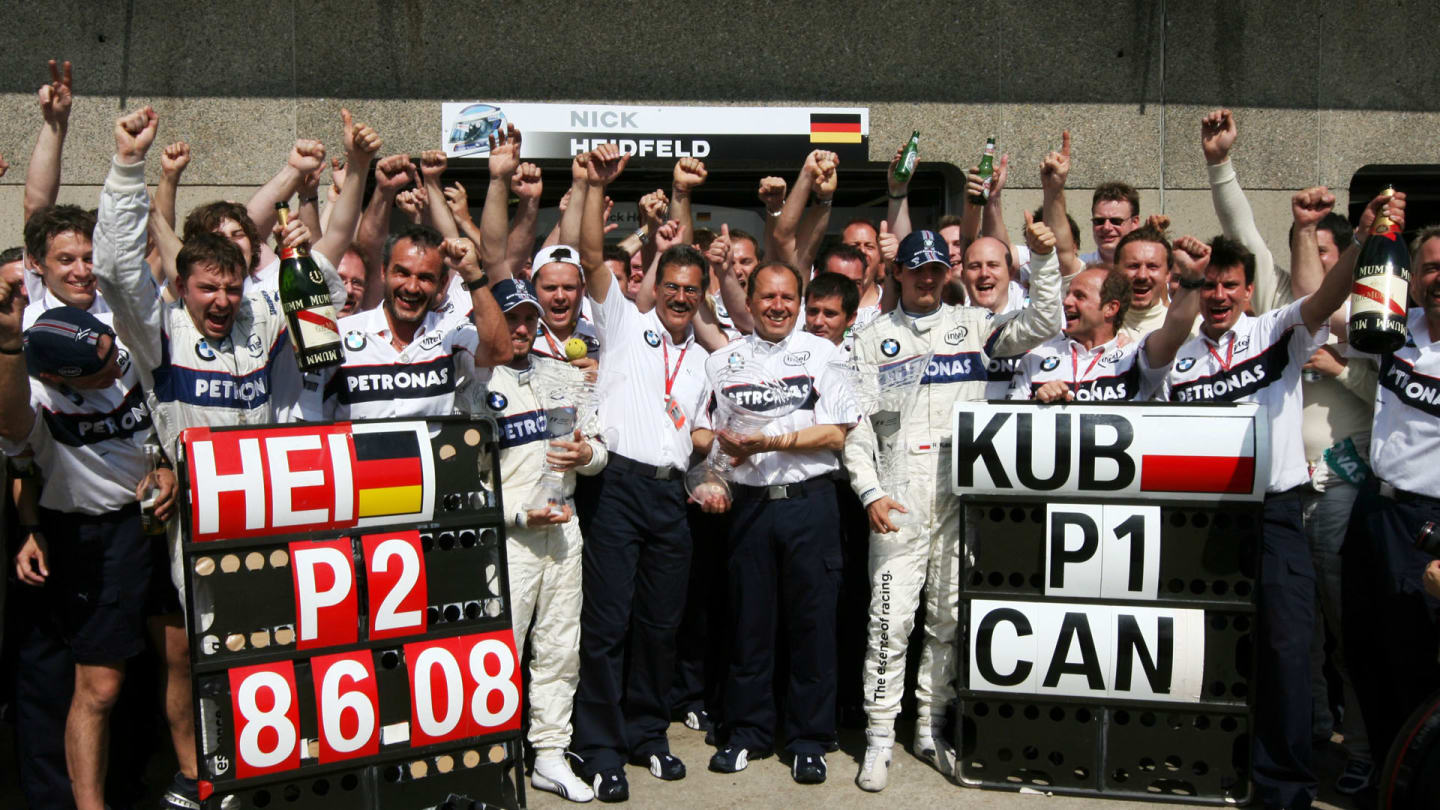 The BMW Sauber team celebrate their first win, a 1-2 finish and the first GP win for Robert Kubica
