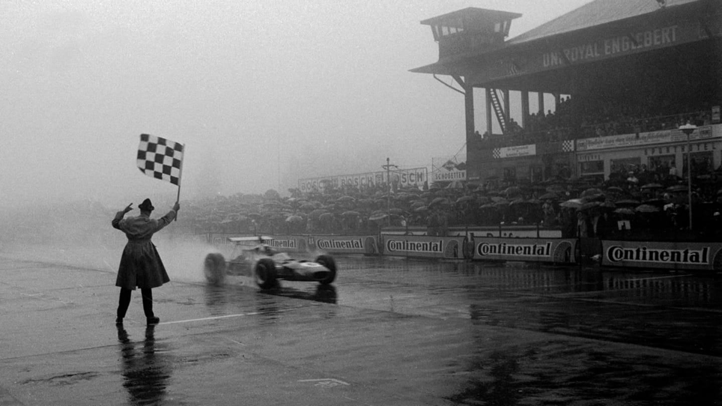Jackie Stewart (GBR) Matra MS10 receives the chequered flag and wins arguably his greatest ever