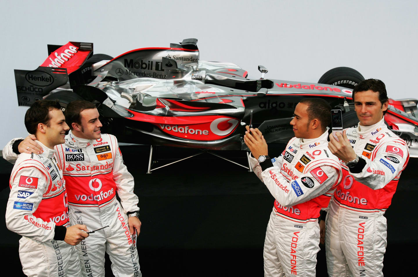 VALENCIA, SPAIN - JANUARY 15:  Lewis Hamilton of Great Britain (2nd R) alongside Pedro de la Rosa