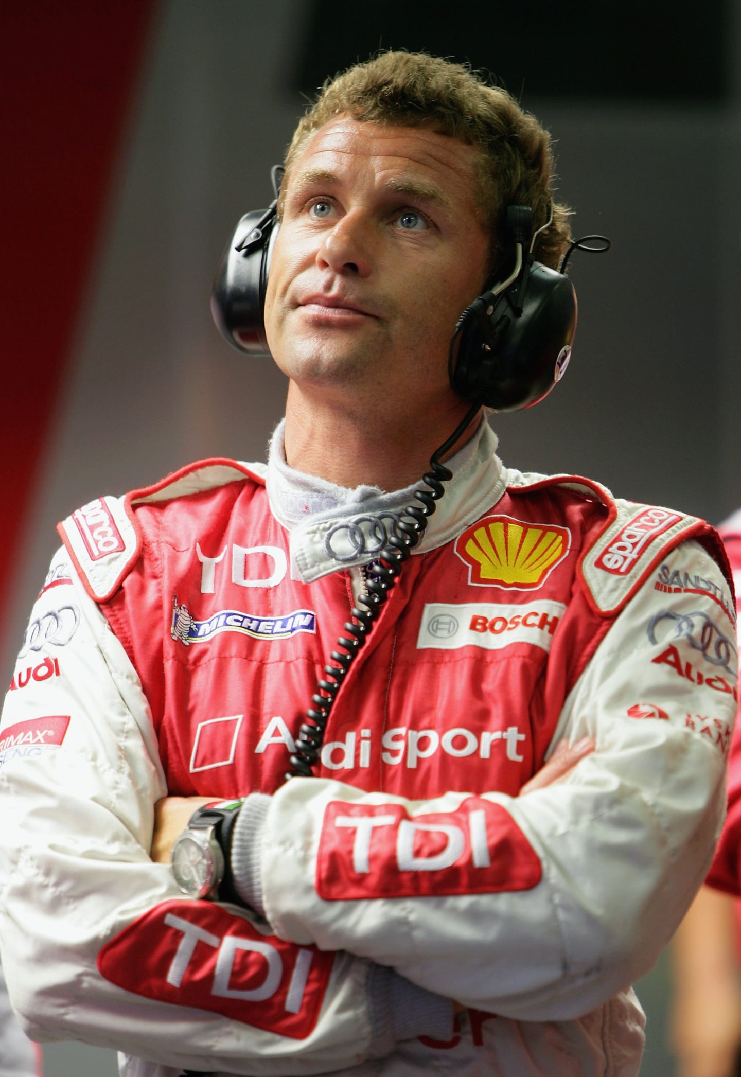 LE MANS, FRANCE - JUNE 14:  Tom Kristensen of Denmark and Audi watches the timing monitors during