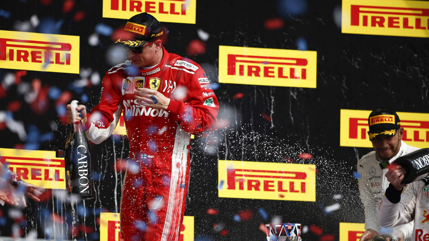 CIRCUIT OF THE AMERICAS, UNITED STATES OF AMERICA - OCTOBER 21: Kimi Raikkonen, Ferrari, 1st position, celebrates with Champagne on the podium during the United States GP at Circuit of the Americas on October 21, 2018 in Circuit of the Americas, United States of America. (Photo by Andy Hone / LAT Images)
