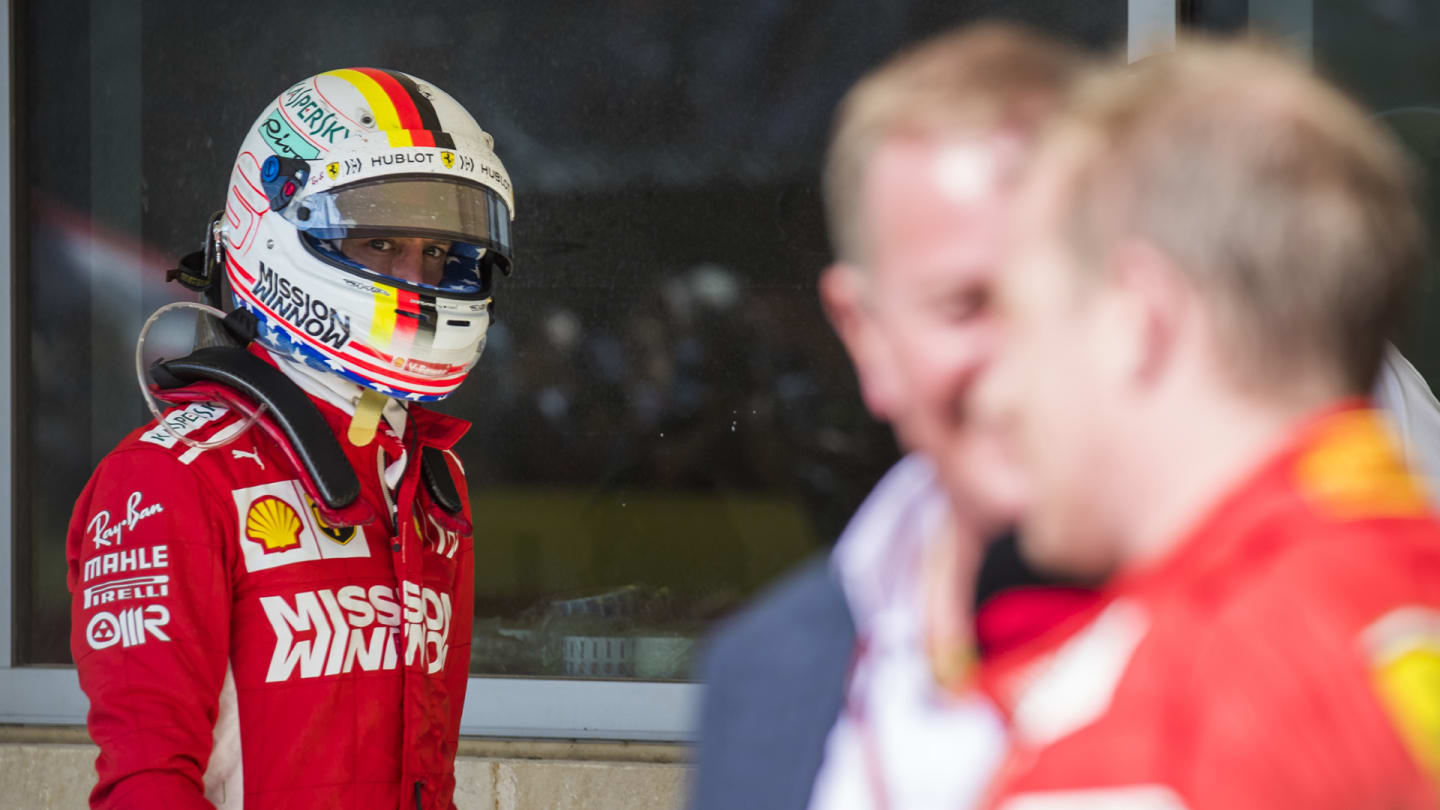 CIRCUIT OF THE AMERICAS, UNITED STATES OF AMERICA - OCTOBER 21: Sebastian Vettel, Ferrari, looks over as Kimi Raikkonen, Ferrari, 1st position, is interviewed by Martin Brundle, Sky Sports F1 during the United States GP at Circuit of the Americas on October 21, 2018 in Circuit of the Americas, United States of America. (Photo by Sam Bloxham / LAT Images)