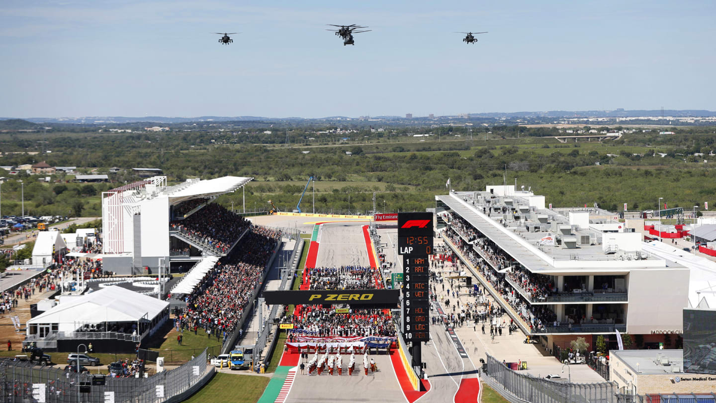 CIRCUIT OF THE AMERICAS, UNITED STATES OF AMERICA - OCTOBER 21: Three Boeing AH-64E Apache gunship helicopters with a pair of Boeing CH-47F Chinook transports from the Dutch Air Force 302 Training Squadron (Fort Hood) fly over the grid during the United States GP at Circuit of the Americas on October 21, 2018 in Circuit of the Americas, United States of America. (Photo by Joe Portlock / LAT Images