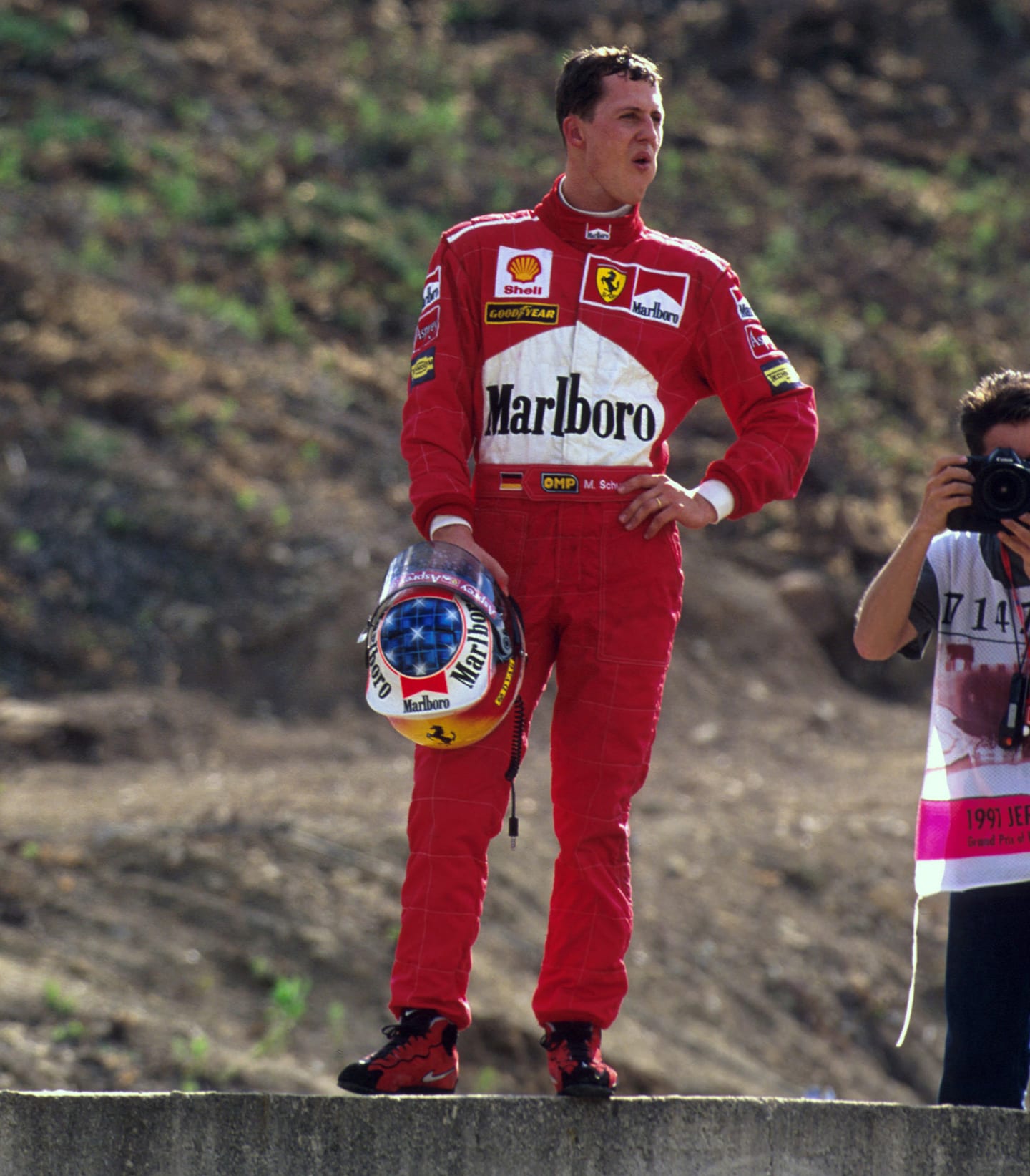 Jerez, Spain.
24-26 October 1997.
Michael Schumacher (Ferrari) takes a moment to reflect, after the