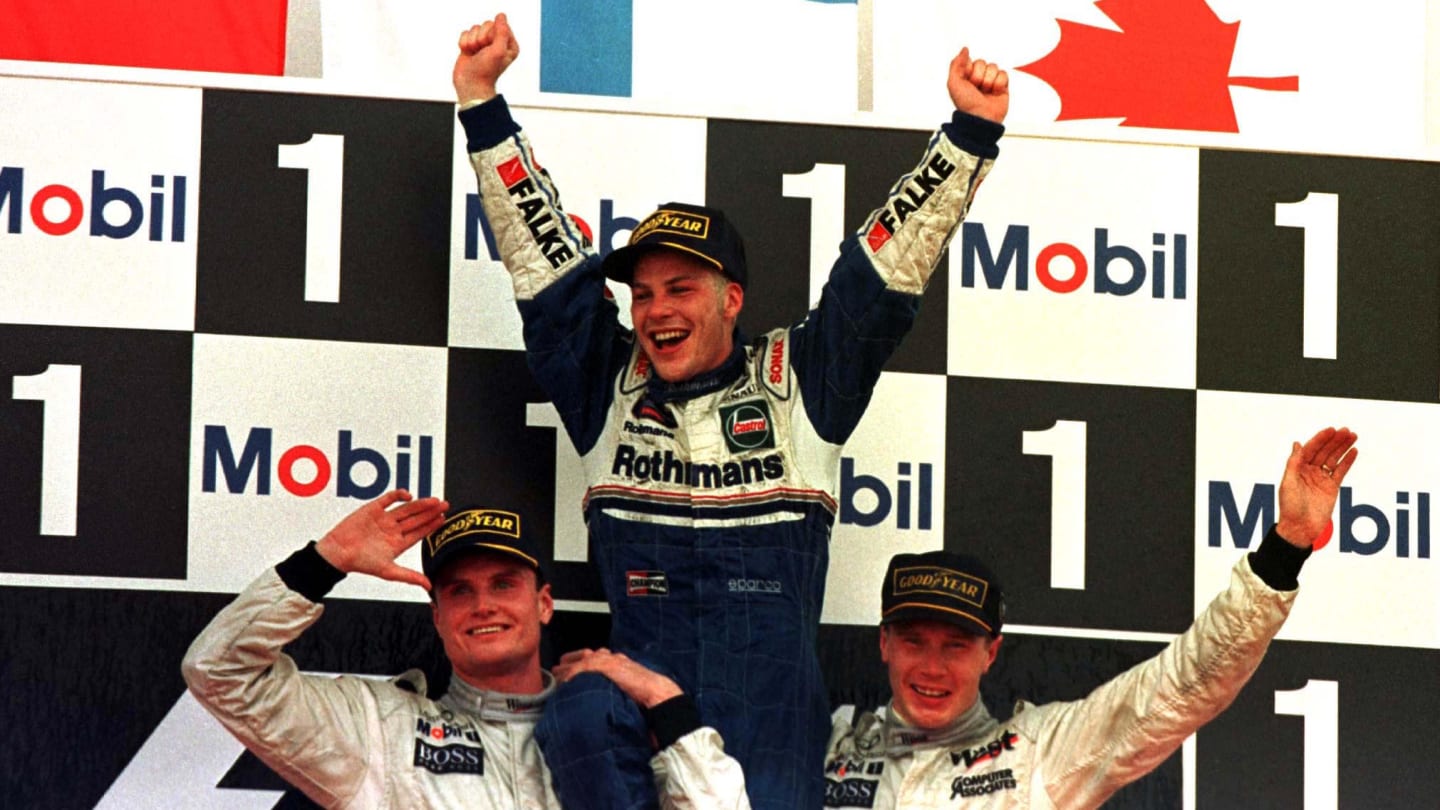 1997 EUROPEAN GP.
New World drivers champion Jacques Villeneuve is lifted shoulder high by Race