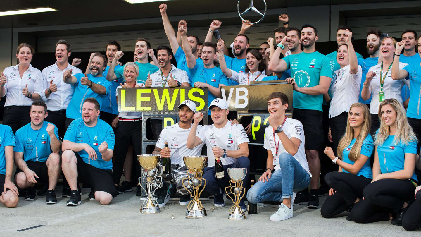 SOCHI, RUSSIA - SEPTEMBER 30: Lewis Hamilton of Mercedes and Great Britain with Valterri Bottas of