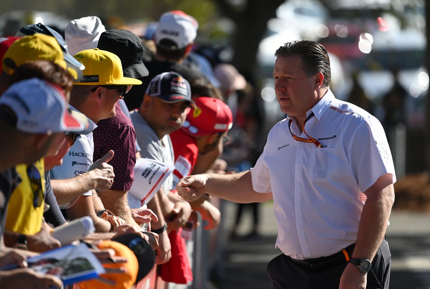 MELBOURNE, AUSTRALIA - MARCH 12: McLaren Chief Executive Officer Zak Brown sings autographs as he