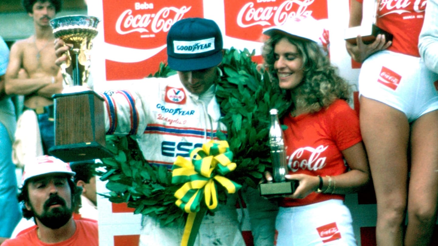 Race winner Rene Arnoux (FRA) Renault with Elio de Angelis (ITA) Lotus Cosworth celebrate on the