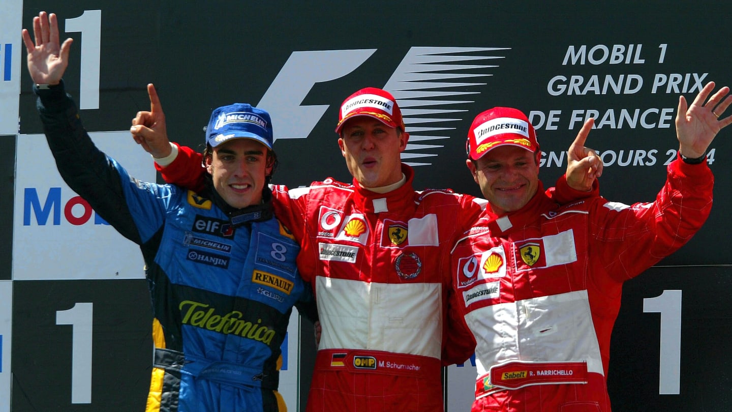The podium finishers (L to R): Fernando Alonso (ESP) Renault 2nd, Michael Schumacher (GER) Ferrari