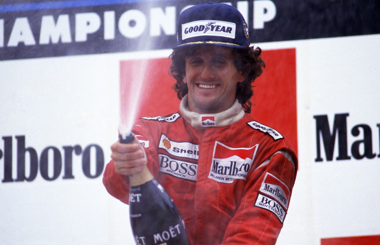 Race winner Alain Prost (FRA) Mclaren celebrates after equalling Jackie Stewarts (GBR) record