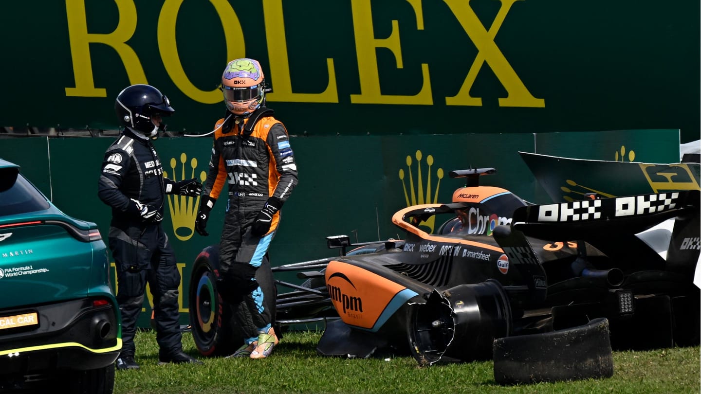 McLaren's Australian driver Daniel Ricciardo gets out of his car after crashing with Haas F1 Team's Danish driver Kevin Magnussen during the Formula One Brazil Grand Prix at the Autodromo Jose Carlos Pace racetrack, also known as Interlagos, in Sao Paulo, Brazil, on November 13, 2022. (Photo by MAURO PIMENTEL / AFP) (Photo by MAURO PIMENTEL/AFP via Getty Images)