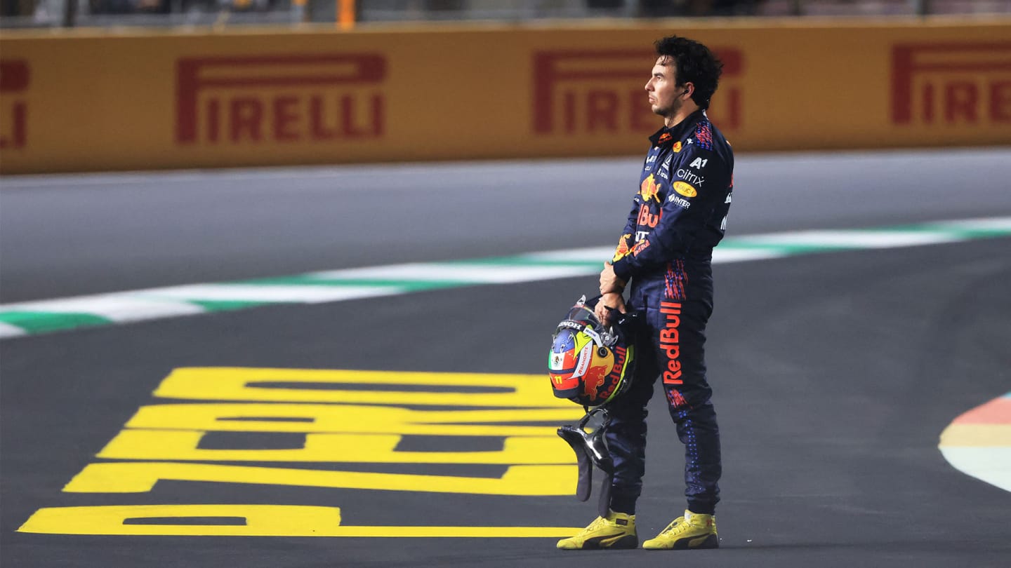 Red Bull's Mexican driver Sergio Perez reacts after a collision during the Formula One Saudi Arabian Grand Prix at the Jeddah Corniche Circuit in Jeddah on December 5, 2021. (Photo by Giuseppe CACACE / AFP) (Photo by GIUSEPPE CACACE/AFP via Getty Images)