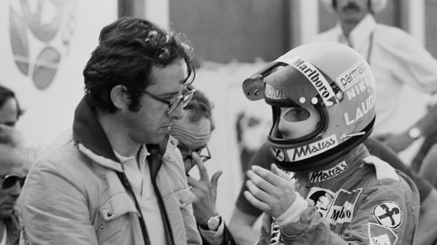 Austrian Formula One driver Niki Lauda discussing with Italian mechanical engineer of Ferrari Mauro