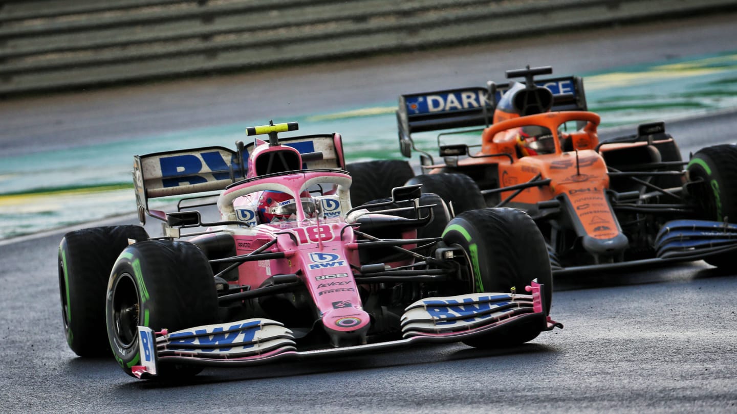 Lance Stroll (CDN) Racing Point F1 Team RP20 and Carlos Sainz Jr (ESP) McLaren MCL35 battle for