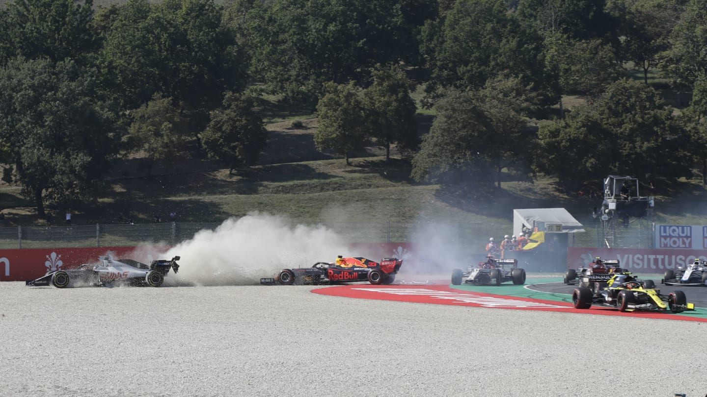 Haas driver Romain Grosjean of France, left, and Red Bull driver Max Verstappen of the Netherlands go of the track during the Formula One Grand Prix of Tuscany, at the Mugello circuit in Scarperia, Italy, Sunday, Sept. 13, 2020. (AP Photo/Luca Bruno, Pool)