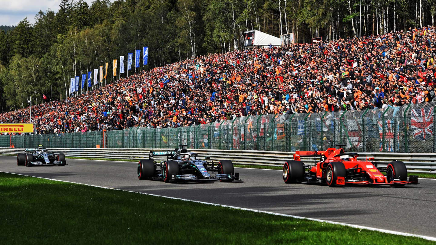 Sebastian Vettel (GER) Ferrari SF90 and Lewis Hamilton (GBR) Mercedes AMG F1 W10 battle for