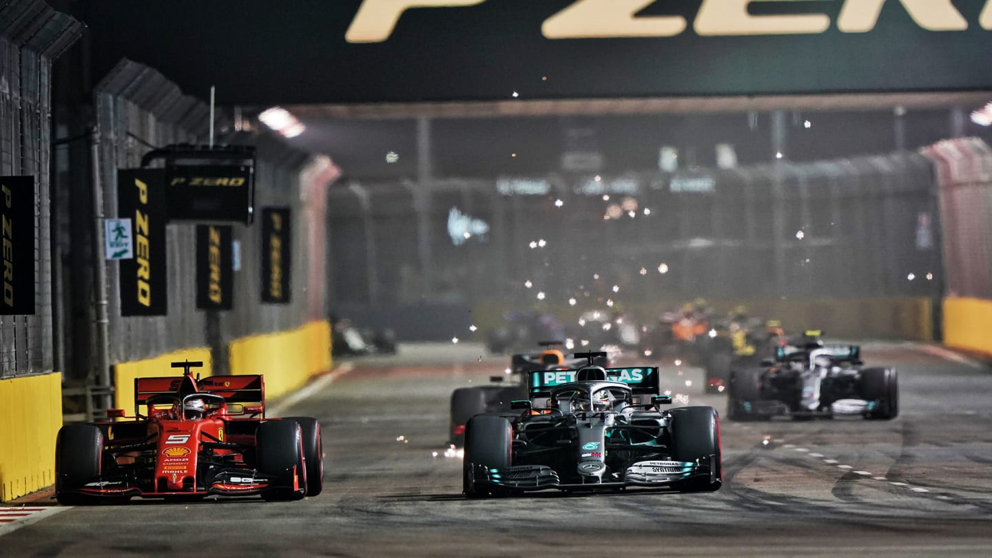 (L to R): Sebastian Vettel (GER) Ferrari and Lewis Hamilton (GBR) Mercedes AMG F1 W10 battle for