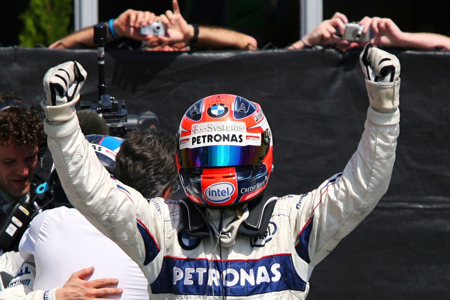 Robert Kubica (POL) BMW Sauber F1.08 celebrates his first GP win in parc ferme.
Formula One World