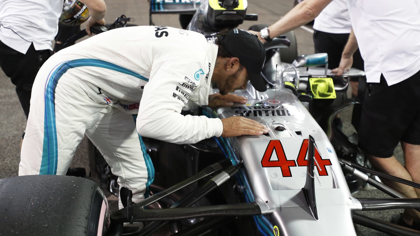 YAS MARINA CIRCUIT, UNITED ARAB EMIRATES - NOVEMBER 24: Lewis Hamilton kisses his Mercedes AMG F1