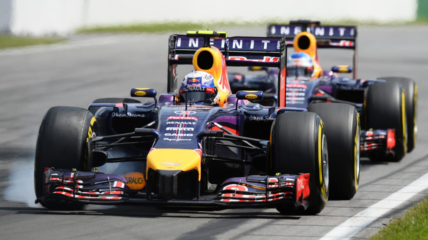 Daniel Ricciardo (AUS) Red Bull Racing RB10 locks up in front of Sebastian Vettel (GER) Red Bull