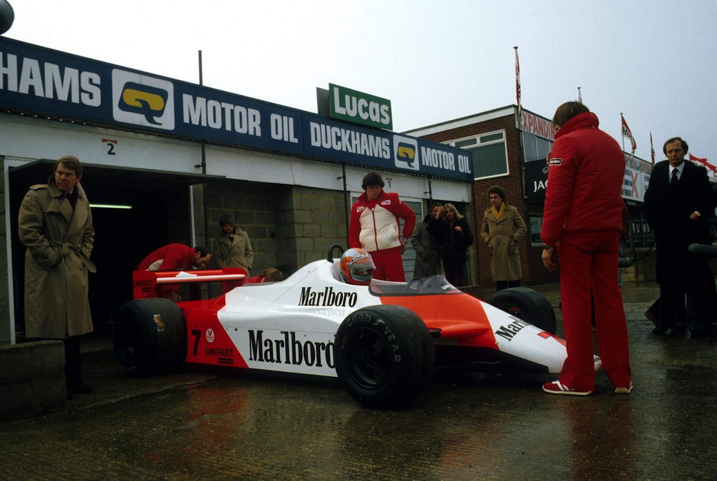 John Watson (GBR) brings the McLaren MP4/1 out of the Silverstone pit garage for its first test.