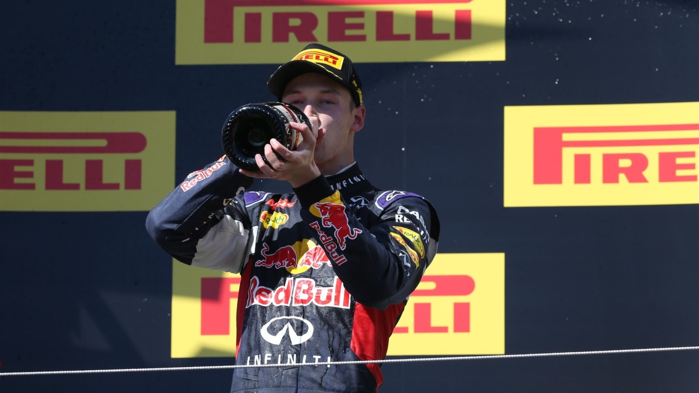 Daniil Kvyat (RUS) Red Bull Racing celebrates with the champagne on the podium at Formula One World