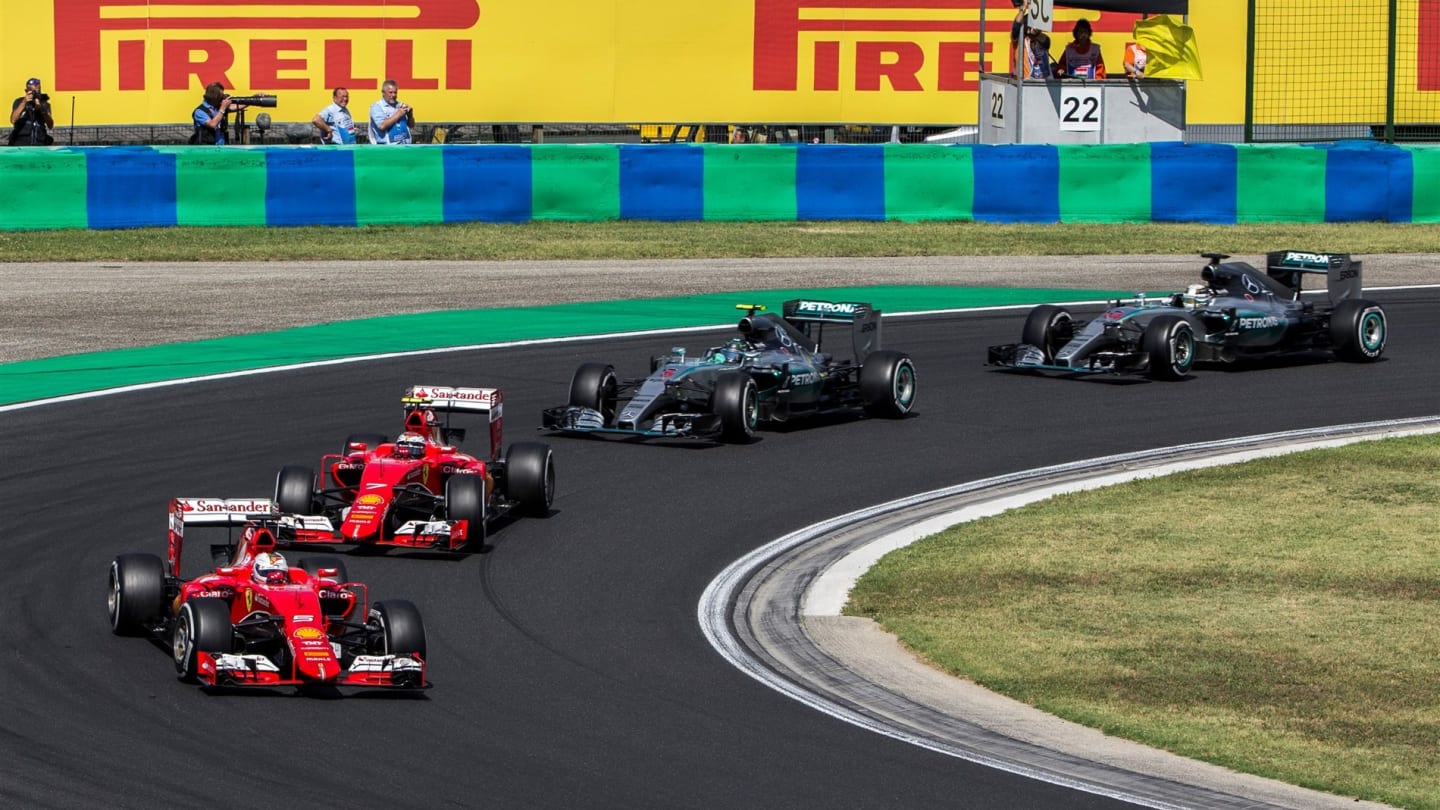 Sebastian Vettel (GER) Ferrari SF15-T restart after the Safety car in front of Kimi Raikkonen (FIN)