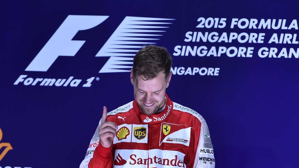 Race winner Sebastian Vettel (GER) Ferrari celebrates on the podium at Formula One World