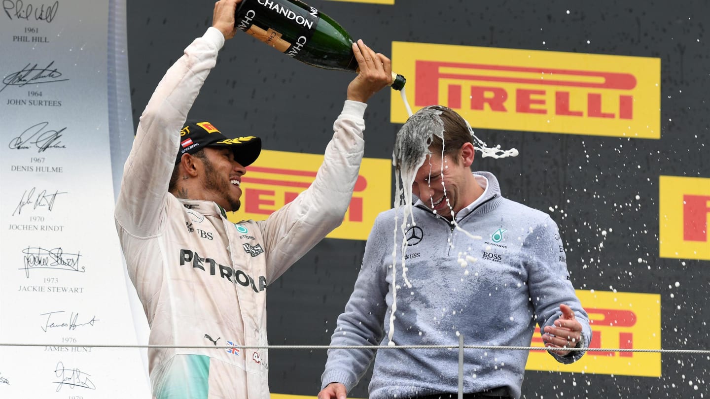 Race winner Lewis Hamilton (GBR) Mercedes AMG F1 celebrates on the podium with James Vowles (GBR)