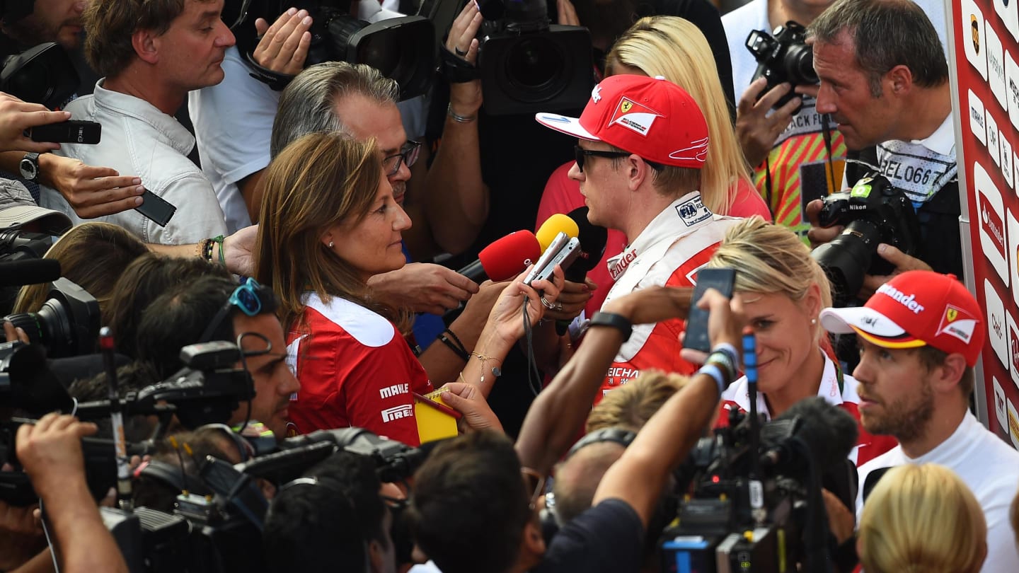 Sebastian Vettel (GER) Ferrari and Kimi Raikkonen (FIN) Ferrari talk with the media at Formula One