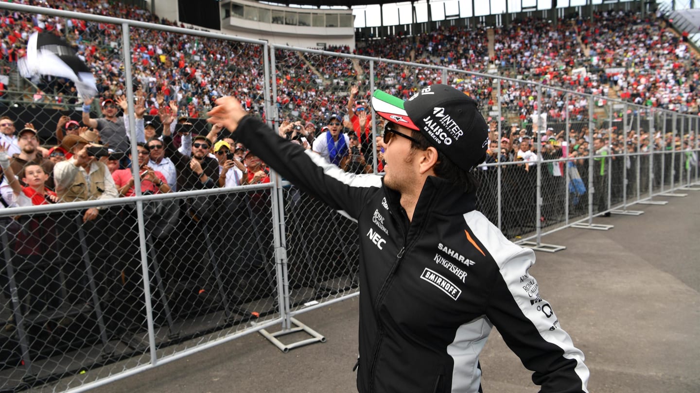 Sergio Perez (MEX) Force India throws hats into the crowd on the drivers parade at Formula One