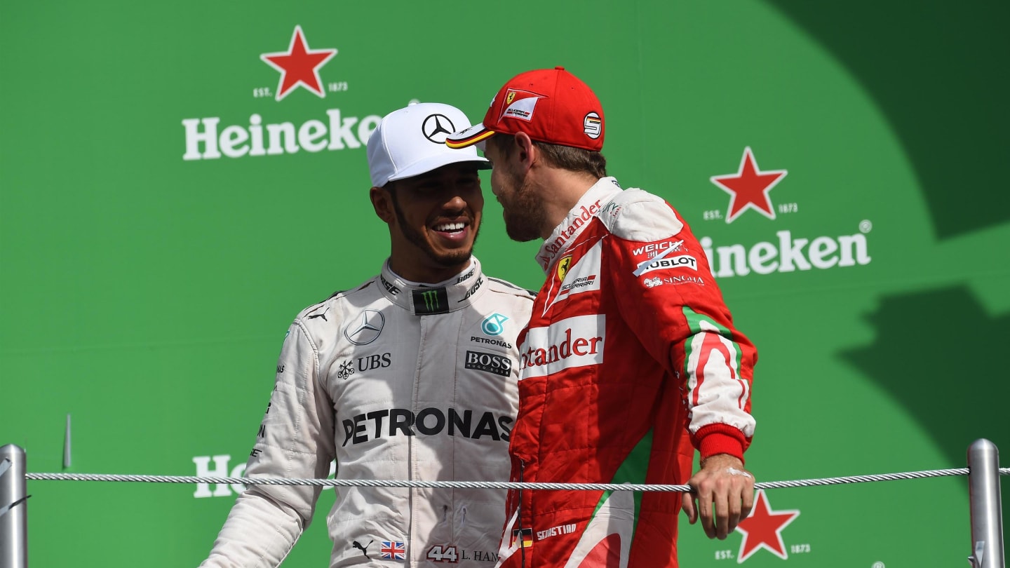 Lewis Hamilton (GBR) Mercedes AMG F1 and Sebastian Vettel (GER) Ferrari celebrate on the podium at