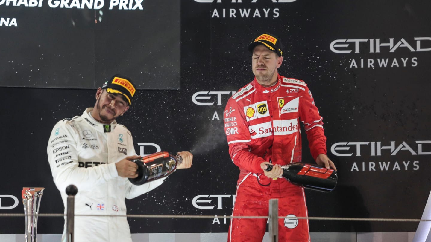 Lewis Hamilton (GBR) Mercedes AMG F1 and Sebastian Vettel (GER) Ferrari celebrate on the podium at Formula One World Championship, Rd20, Abu Dhabi Grand Prix, Race, Yas Marina Circuit, Abu Dhabi, UAE, Sunday 26 November 2017. © Manuel Goria/Sutton Images