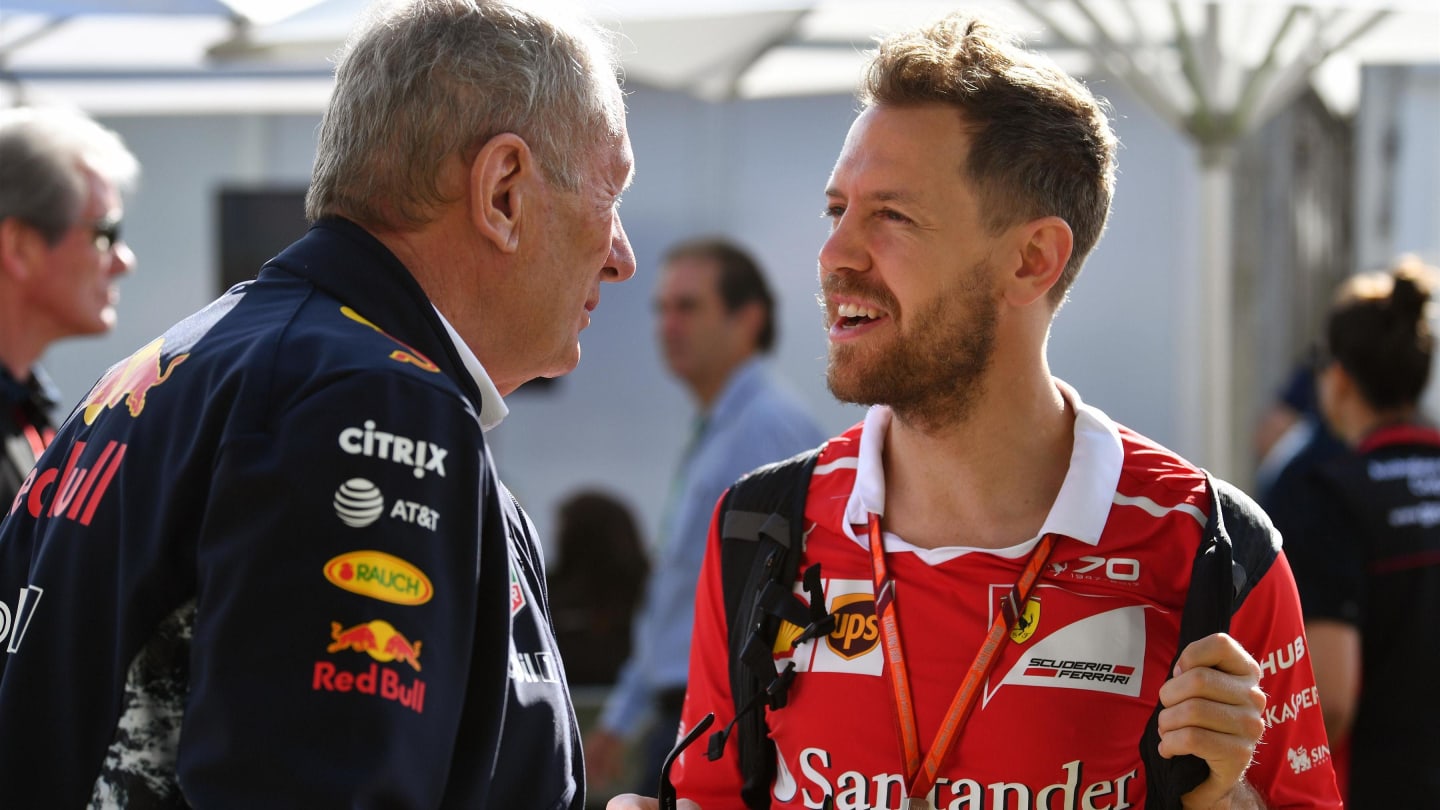 Dr Helmut Marko (AUT) Red Bull Motorsport Consultant and Sebastian Vettel (GER) Ferrari at Formula