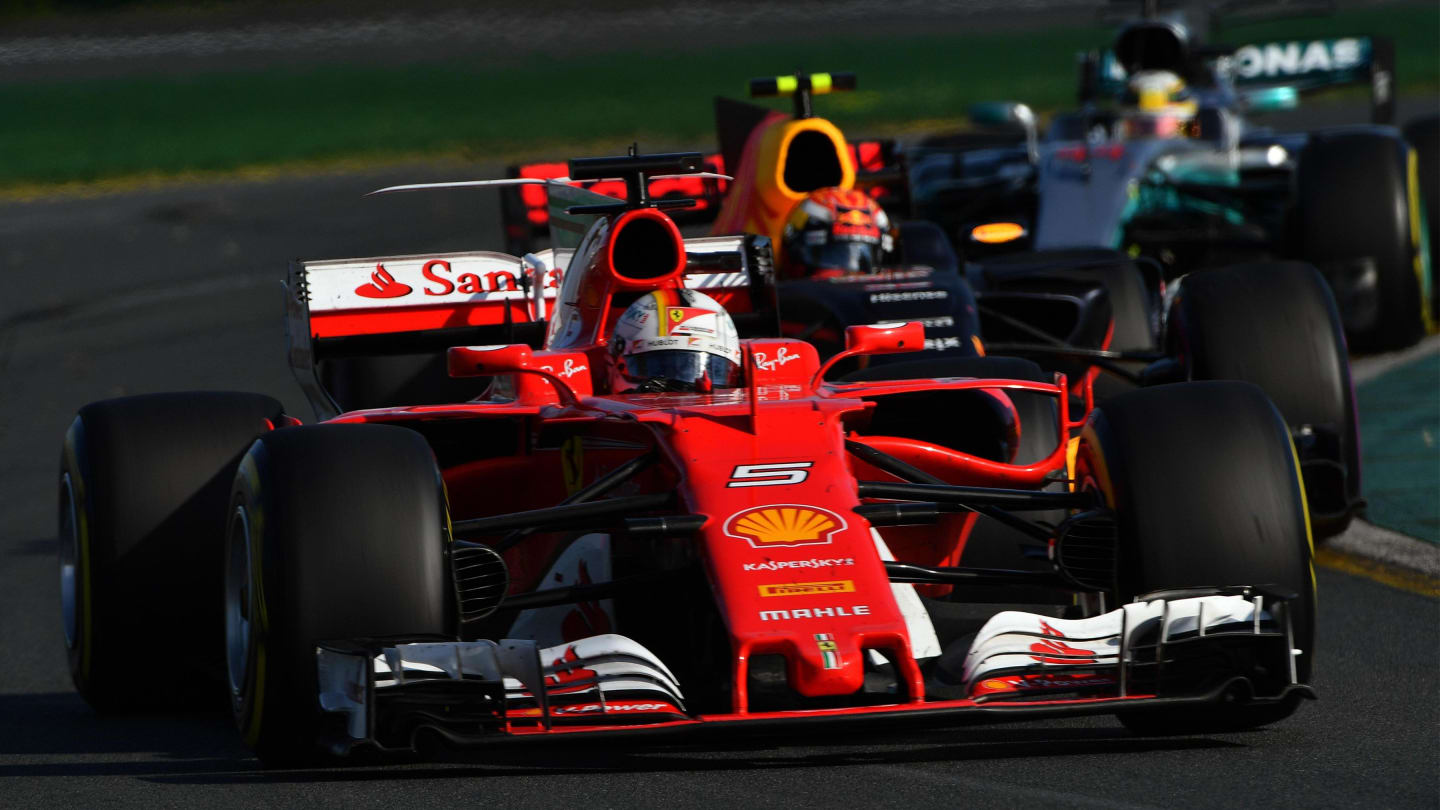 Sebastian Vettel (GER) Ferrari SF70-H leads Max Verstappen (NED) Red Bull Racing RB13 and Lewis