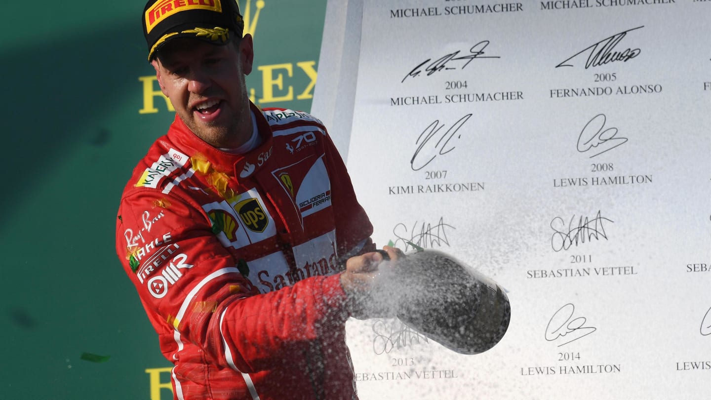 Sebastian Vettel (GER) Ferrari celebrates on the podium with the champagne at Formula One World Championship, Rd1, Australian Grand Prix, Race, Albert Park, Melbourne, Australia, Sunday 26 March 2017. © Sutton Motorsport Images