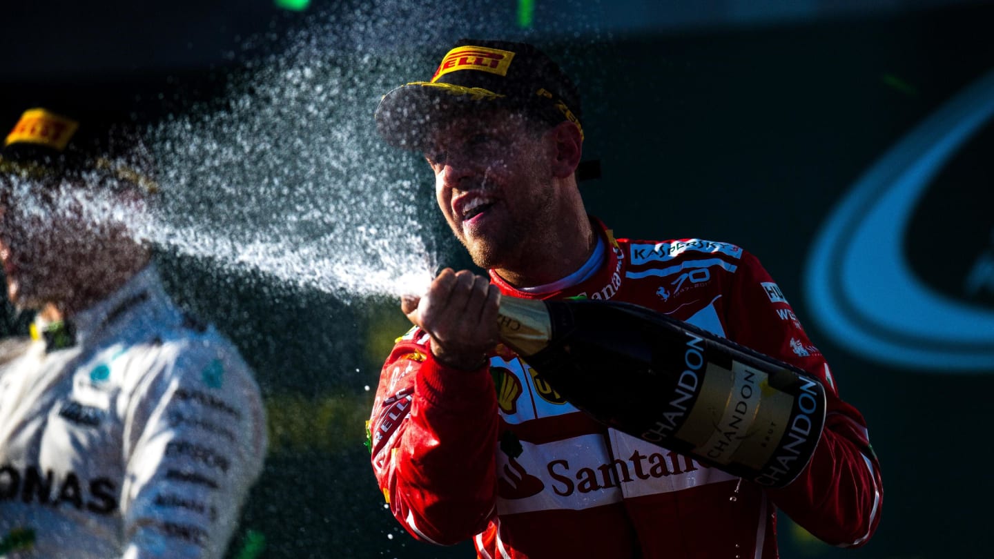 Race winner Sebastian Vettel (GER) Ferrari celebrates on the podium with the champagne at Formula One World Championship, Rd1, Australian Grand Prix, Race, Albert Park, Melbourne, Australia, Sunday 26 March 2017. © Sutton Motorsport Images