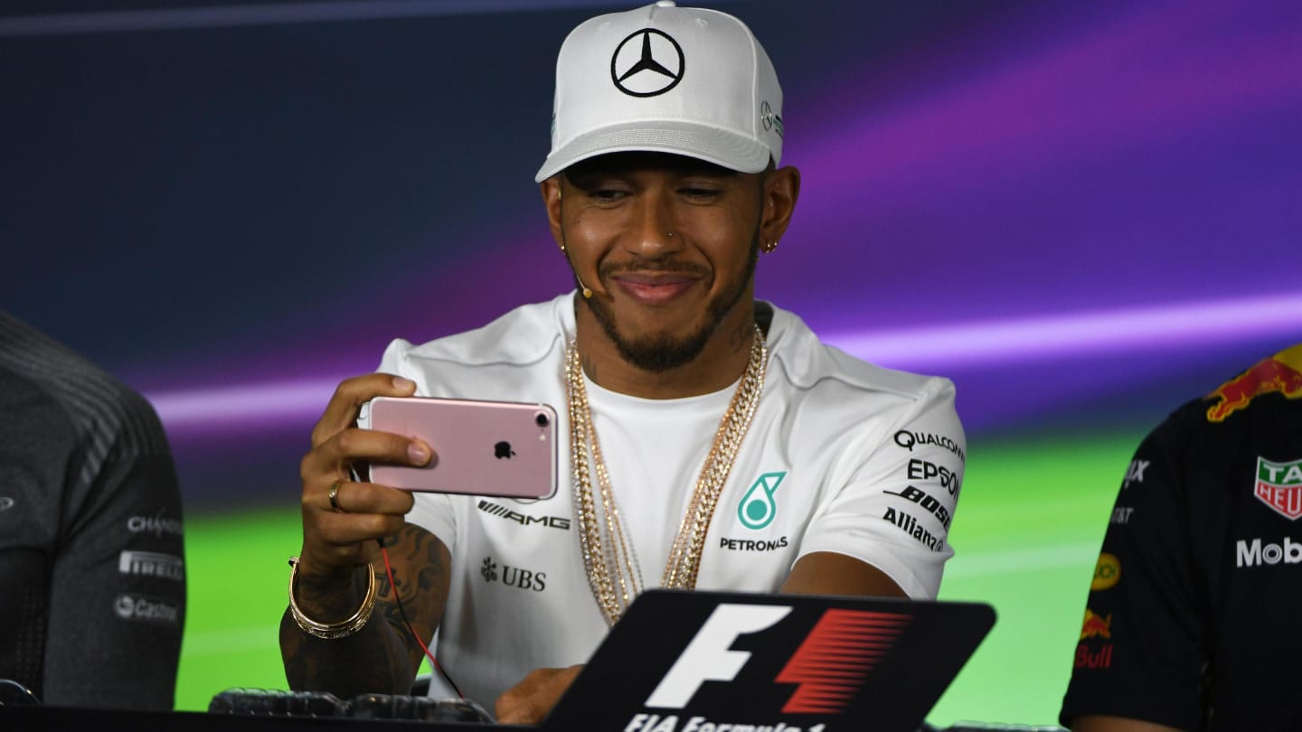 Lewis Hamilton (GBR) Mercedes AMG F1 in the Press Conference with his phone at Formula One World Championship, Rd1, Australian Grand Prix, Preparations, Albert Park, Melbourne, Australia, Thursday 23 March 2017. © Sutton Motorsport Images