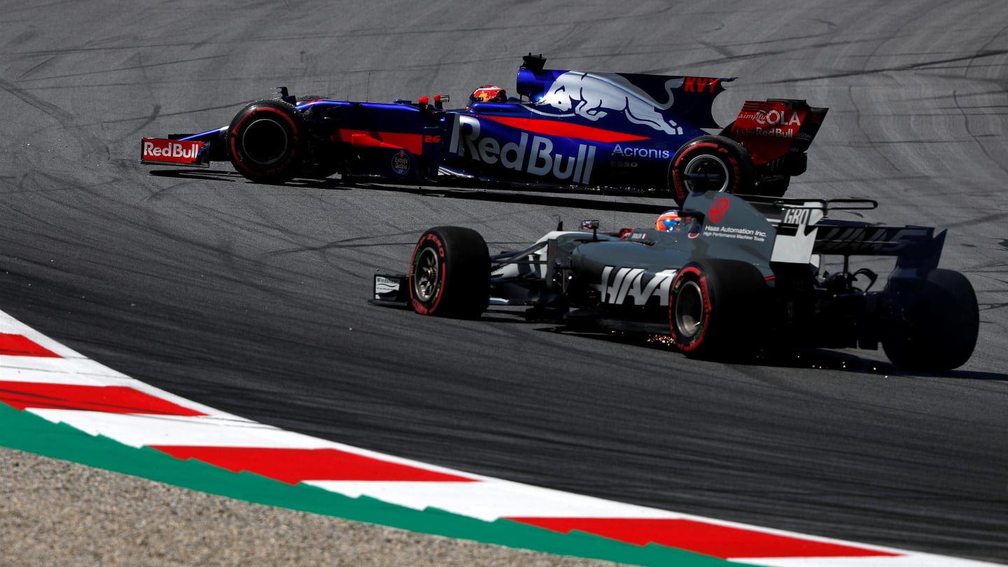 Romain Grosjean (FRA) Haas VF-17 with front puncture and Daniil Kvyat (RUS) Scuderia Toro Rosso STR12 spins at Formula One World Championship, Rd9, Austrian Grand Prix, Practice, Spielberg, Austria, Friday 7 July 2017. © Sutton Images