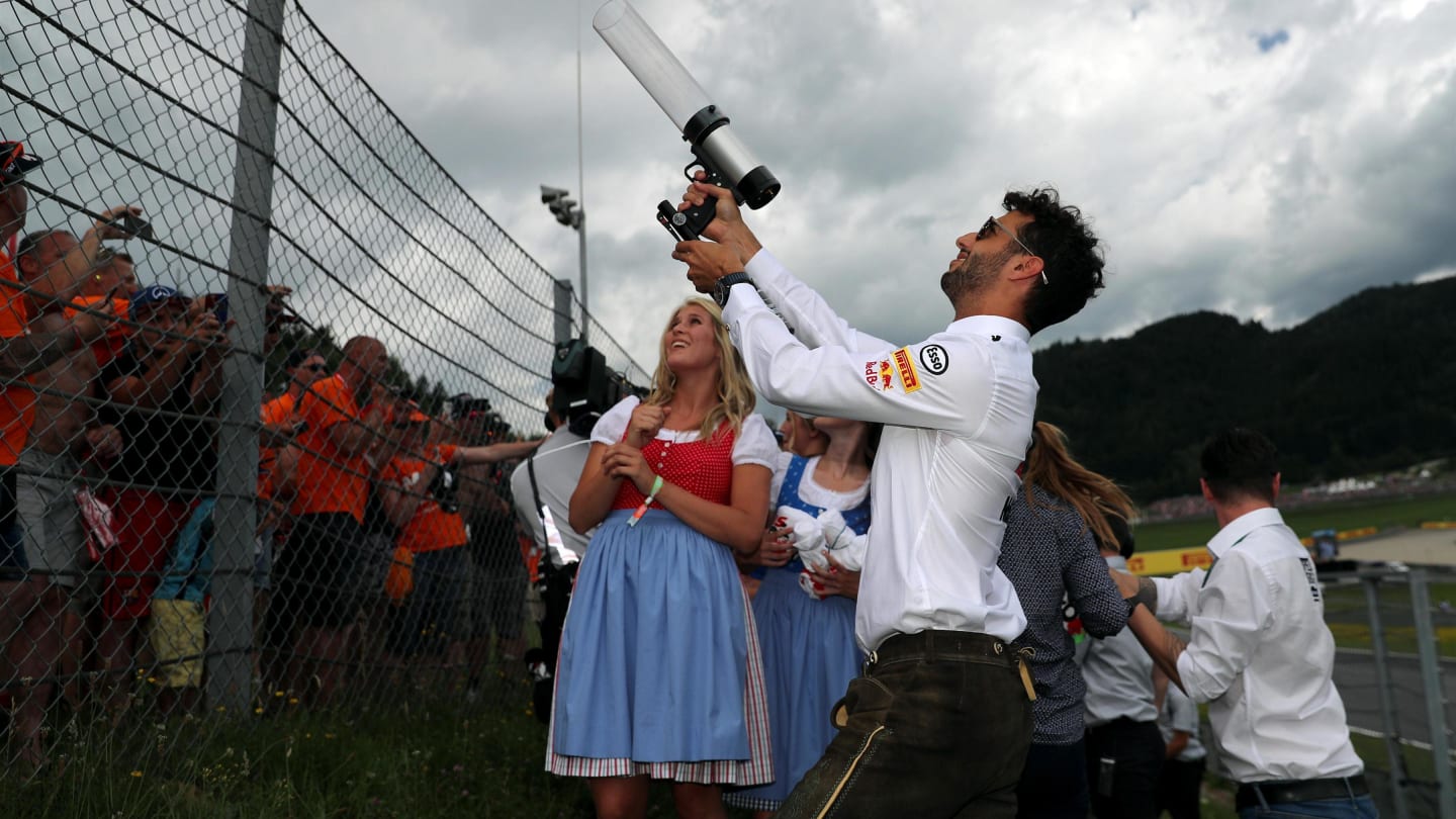 Daniel Ricciardo (AUS) Red Bull Racing fires T-Shirts into the crowd with T-Shirt gun at Formula One World Championship, Rd9, Austrian Grand Prix, Race, Spielberg, Austria, Sunday 9 July 2017. © Sutton Images