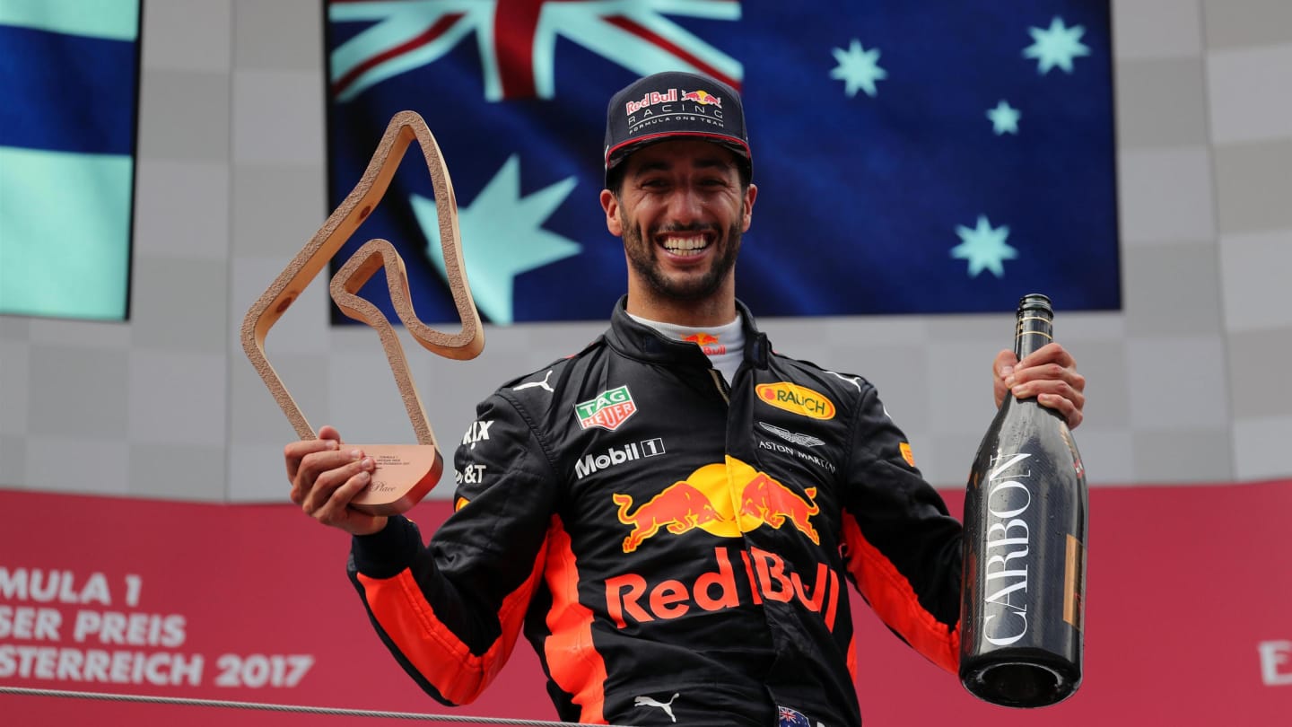 Daniel Ricciardo (AUS) Red Bull Racing celebrates on the podium with the trophy and the champagne at Formula One World Championship, Rd9, Austrian Grand Prix, Race, Spielberg, Austria, Sunday 9 July 2017. © Sutton Images