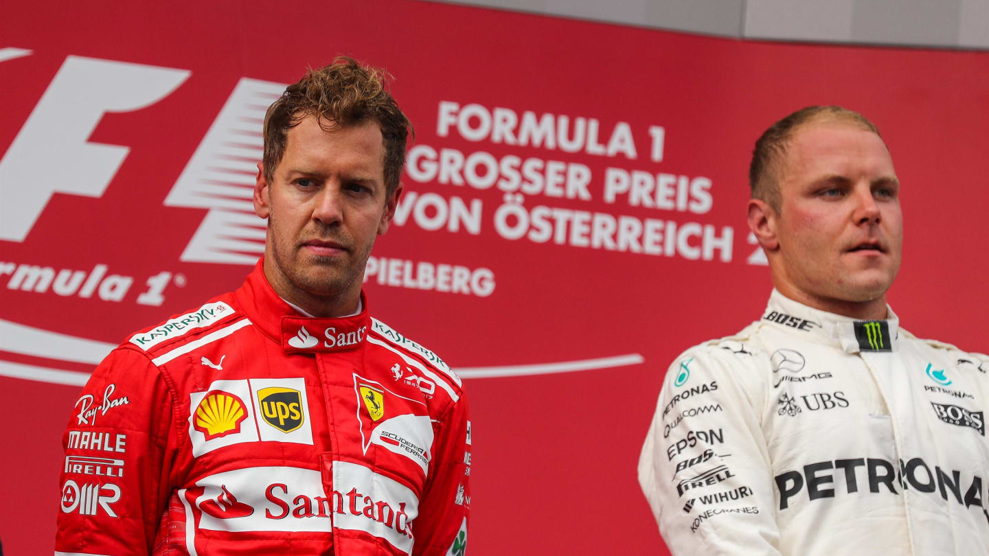 Sebastian Vettel (GER) Ferrari and Valtteri Bottas (FIN) Mercedes AMG F1 celebrate on the podium at