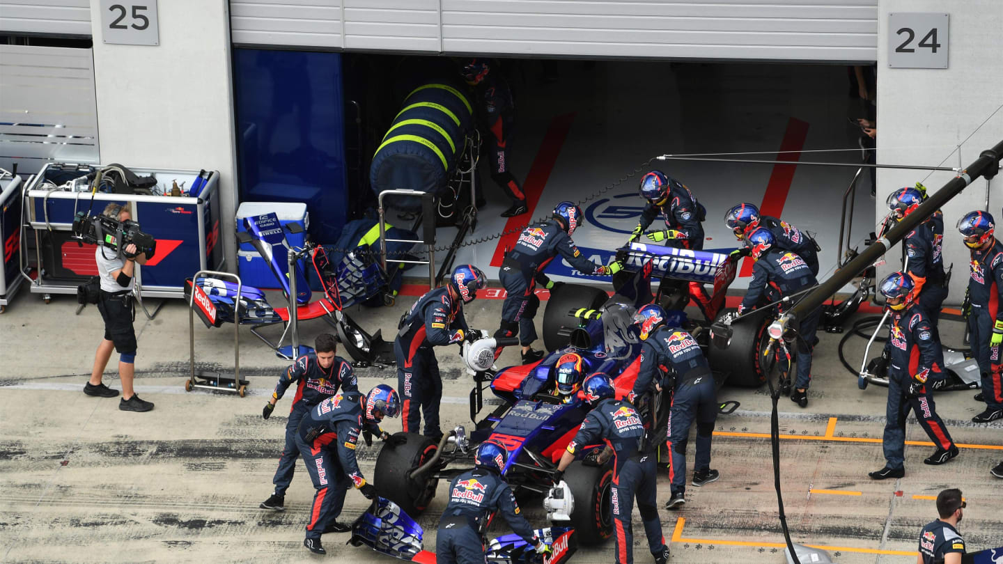 The car of race retiree Carlos Sainz (ESP) Scuderia Toro Rosso STR12 is pushed back into the garage by mechanics at Formula One World Championship, Rd9, Austrian Grand Prix, Race, Spielberg, Austria, Sunday 9 July 2017. © Sutton Images