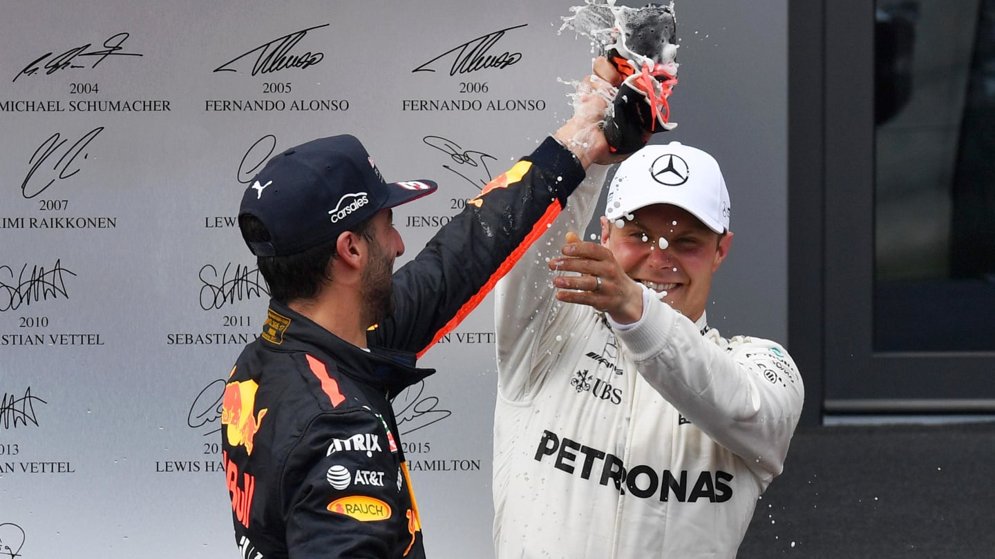 Daniel Ricciardo (AUS) Red Bull Racing and Valtteri Bottas (FIN) Mercedes AMG F1 celebrate with the