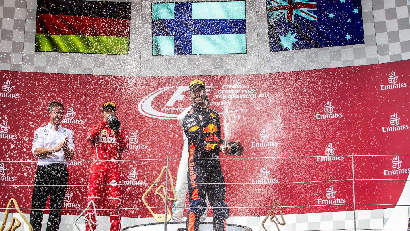 Daniel Ricciardo (AUS) Red Bull Racing celebrates iwht the champagne on the podium at Formula One World Championship, Rd9, Austrian Grand Prix, Race, Spielberg, Austria, Sunday 9 July 2017. © Sutton Images