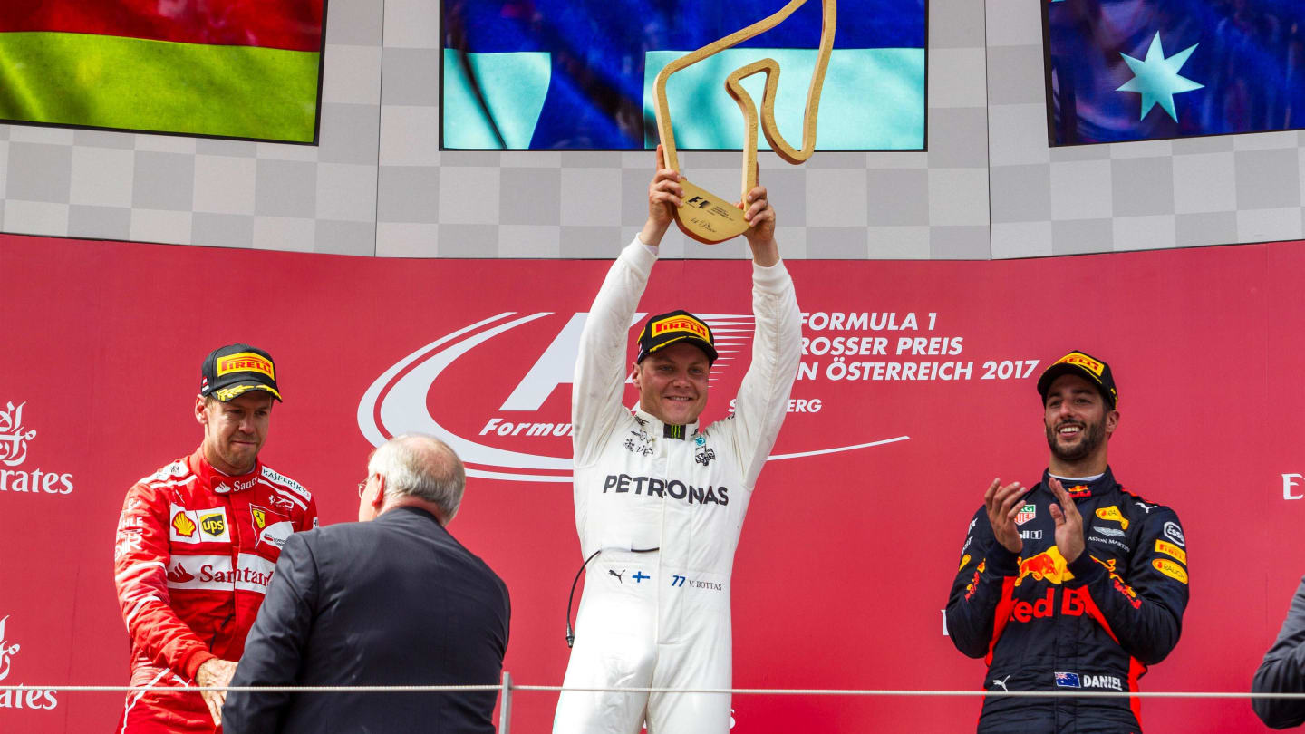 Valtteri Bottas (FIN) Mercedes AMG F1 celebrates on the podium with the trophy at Formula One World