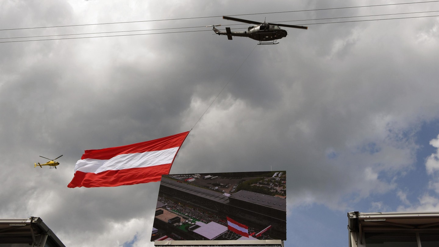 Helicopter flies giant Austrian flag over the grid at Formula One World Championship, Rd9, Austrian Grand Prix, Race, Spielberg, Austria, Sunday 9 July 2017. © Sutton Images